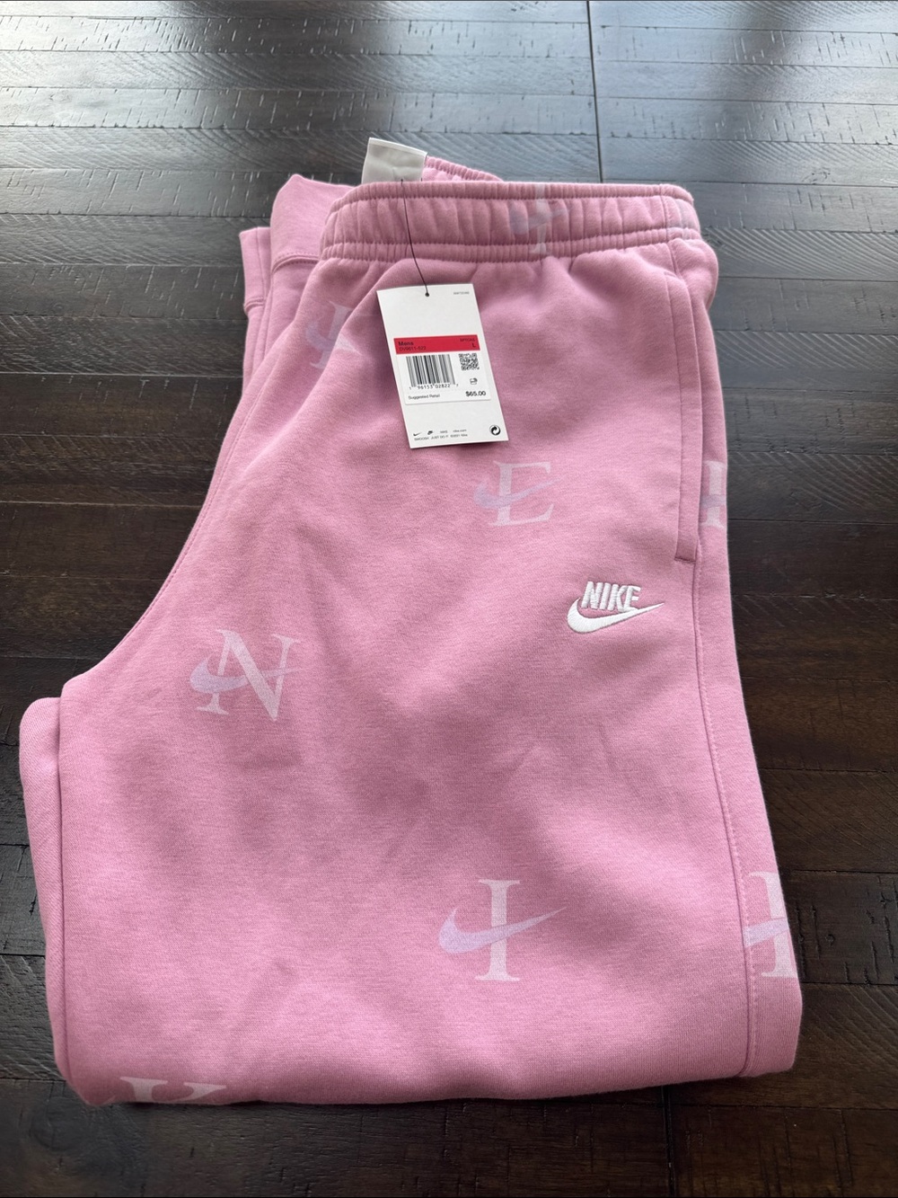 NWT Nike Men’s Pink Tapered Joggers with Subtle Logo